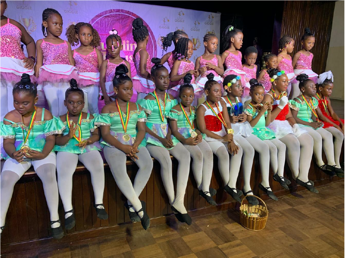 Deacons Academy ballet troupe - large group of girls with medals on stage